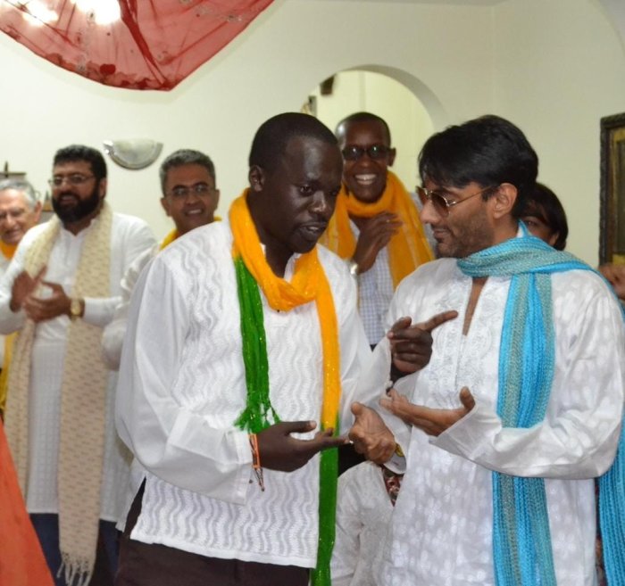 Haron Owalo in conversation with a member of the community